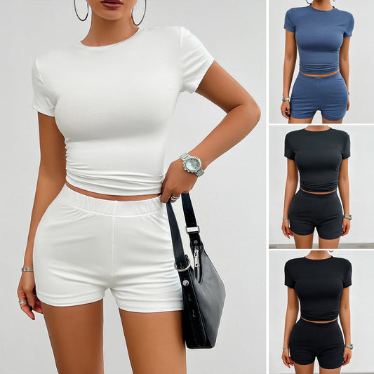 Solid color slim sports suit for women, 2-piece summer outfit with short-sleeved round neck T-shirt and elastic shorts in white, blue, and black.